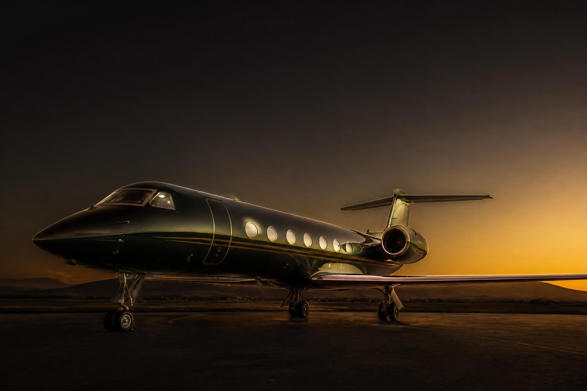 Private business jet on the apron at dusk